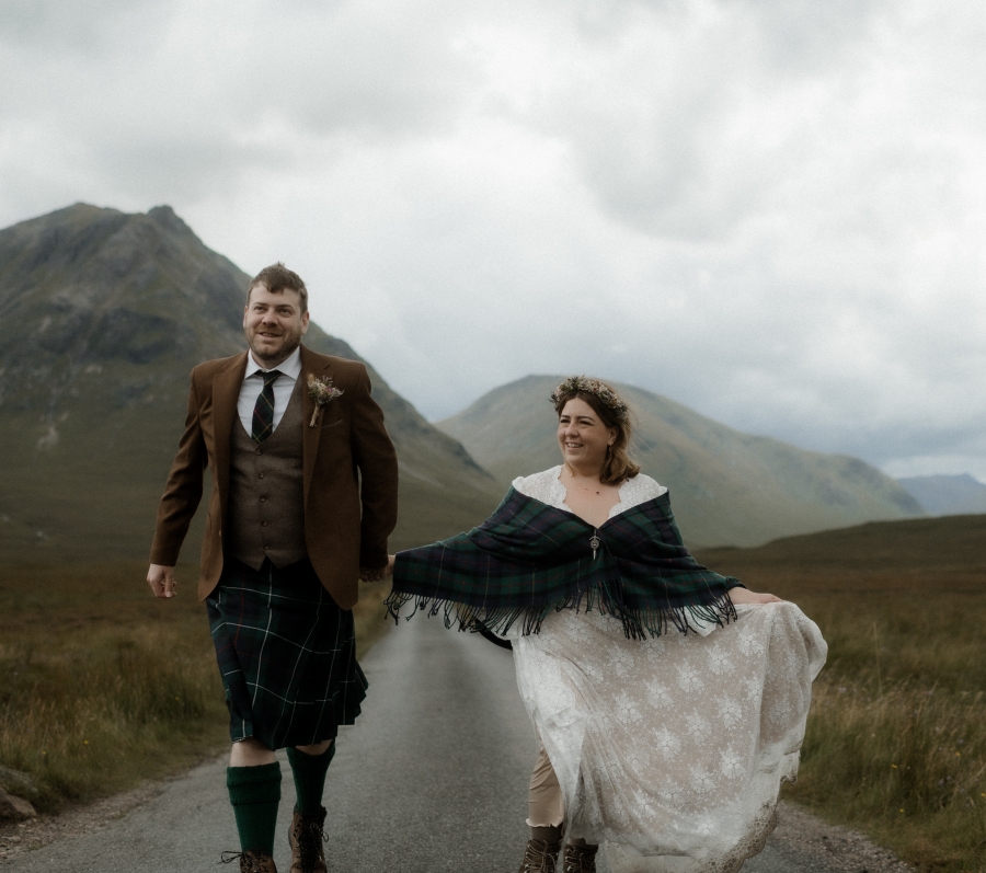 Kaitlyn and Dan standing together with a beautiful landscape in the background.