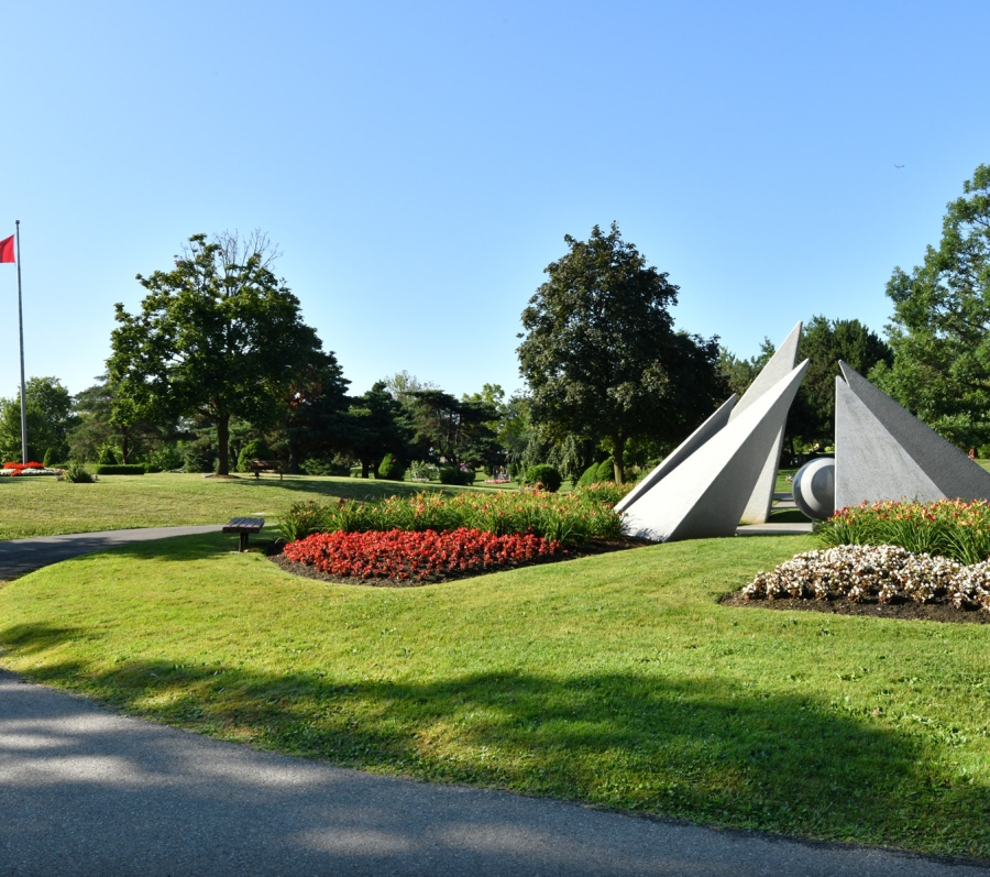Memorial at Meadowvale Cemetery with Canadian flag in the background