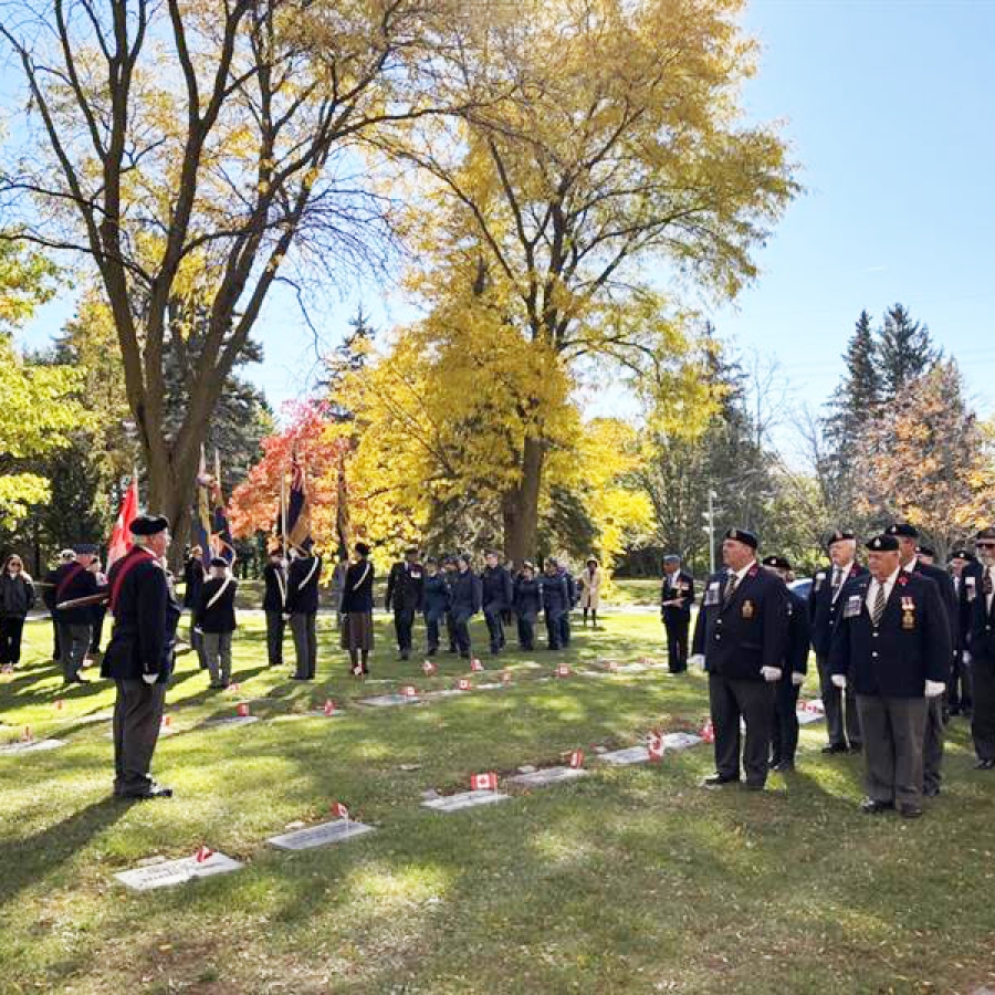 Attendees gathered for a remembrance service on cemetery grounds.