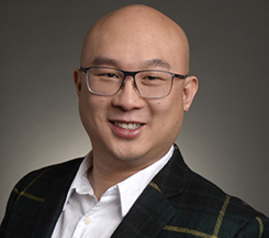 bald asian man with glasses