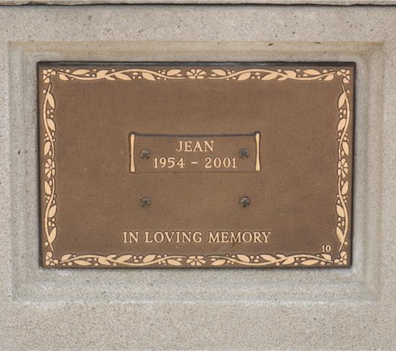 plaque with a name and a year of birth and death