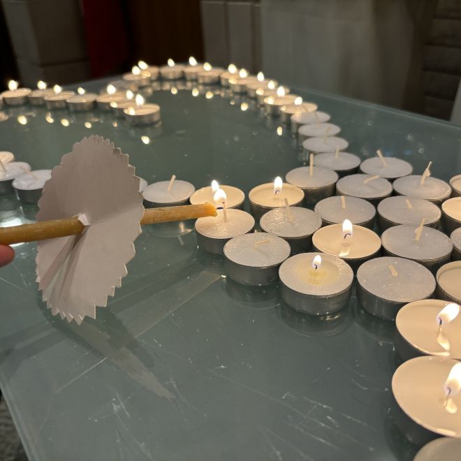 tealight candles arranged in a heart shape