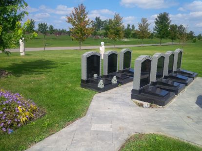 cremation markers in grassy area