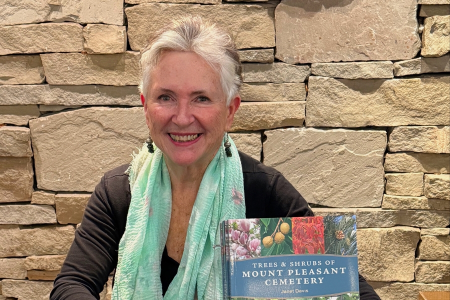 Author presenting “Trees & Shrubs of Mount Pleasant Cemetery” book.