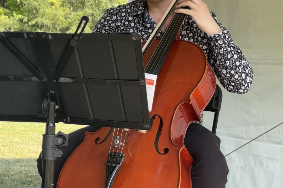 a man playing an instrument outside