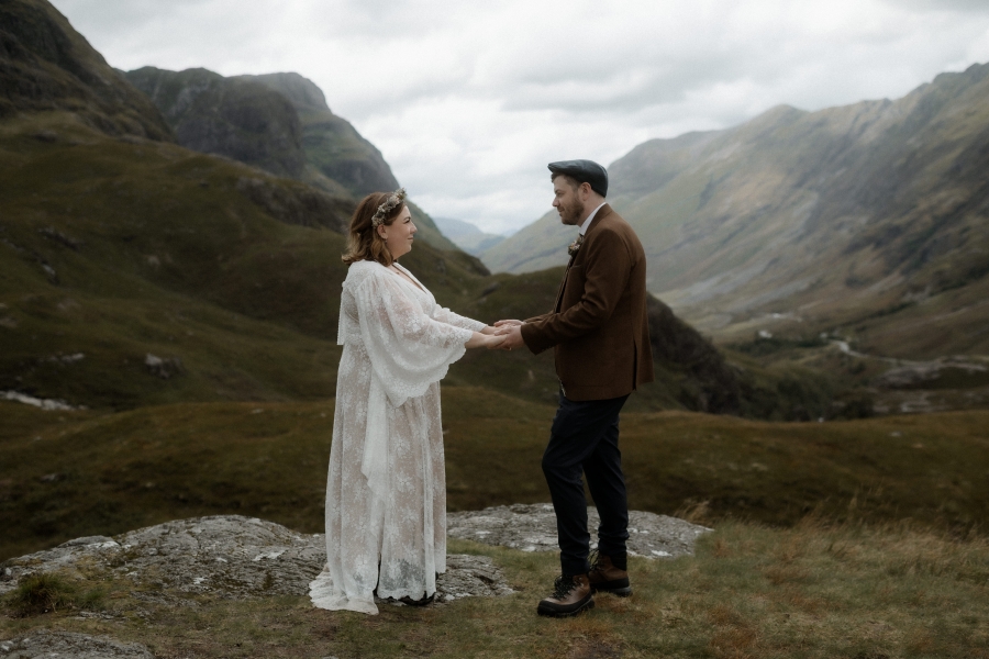 Kaitlyn and Dan standing together with a beautiful landscape in the background.