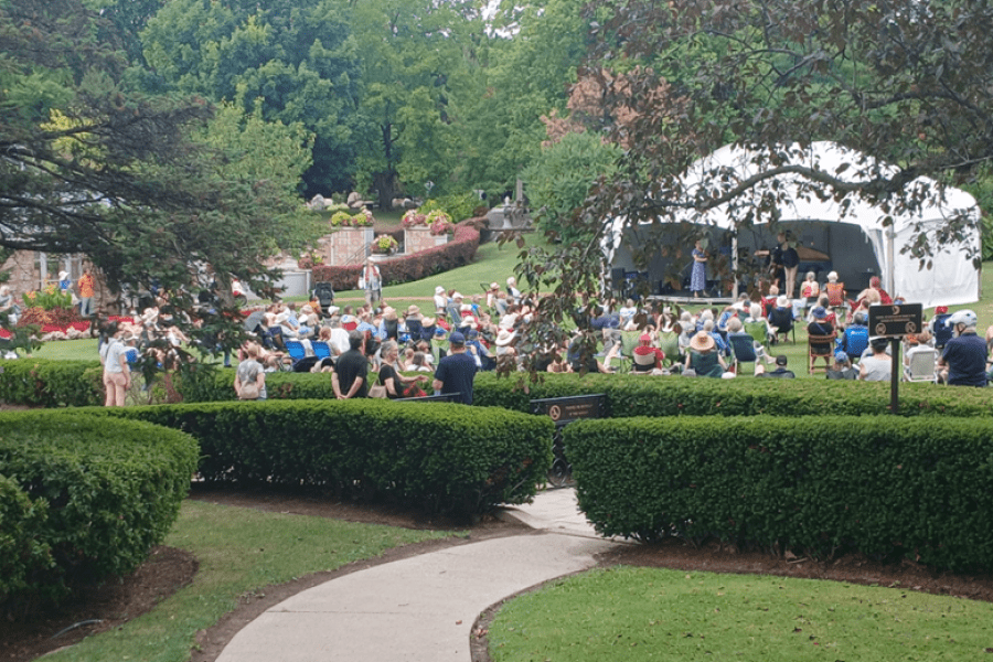 people gathered for a music concert in the park