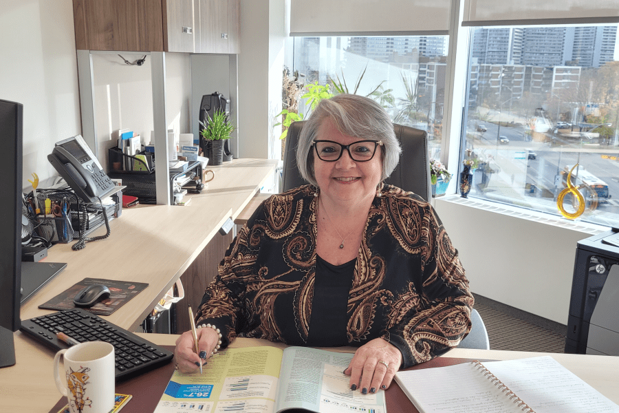Angie Aquino at her desk
