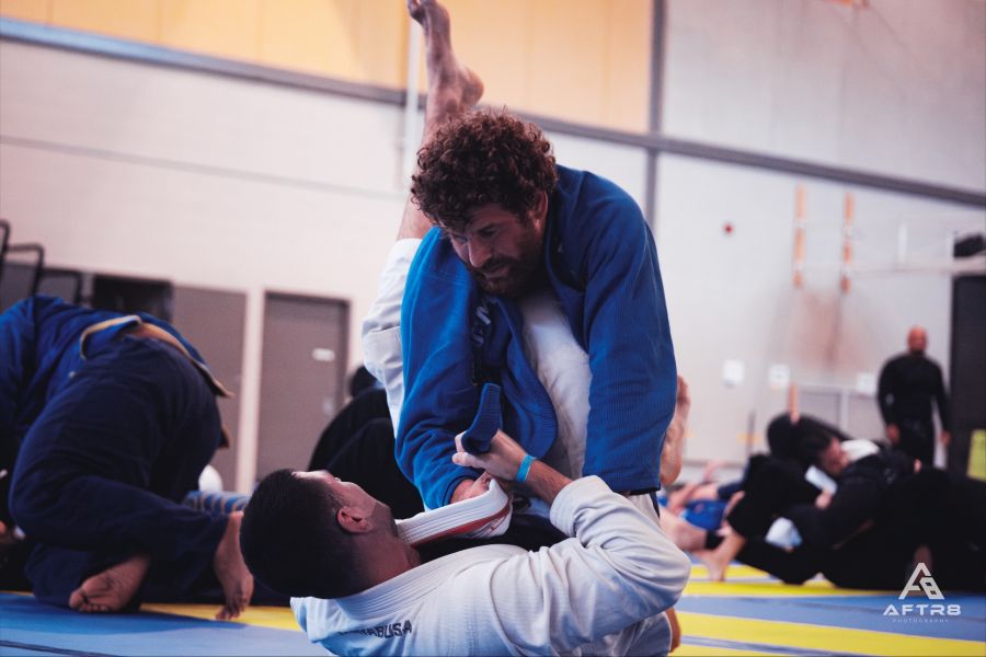 Brazilian Jiu Jitsu practitioners demonstrating a grappling technique.