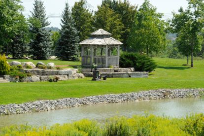 Peaceful view of Duffin Meadows Cemetery, highlighting its tranquil grounds, mature trees, and historic memorials.